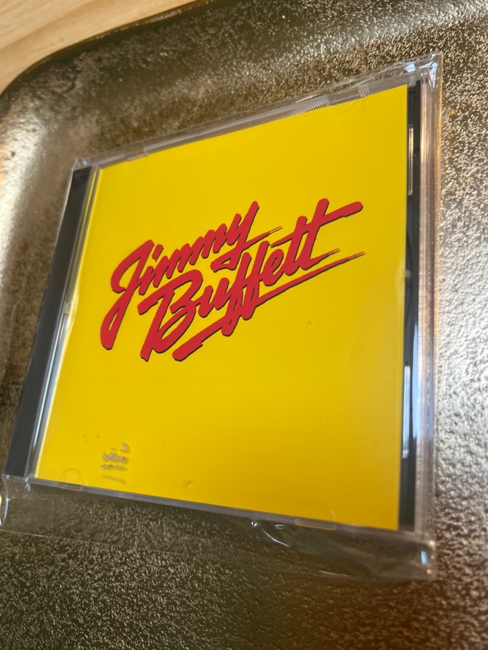 1730** Jimmy Buffett CD with Bold Yellow Cover